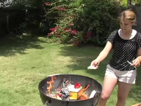 File:0498-SarahburningCarlstuff.jpg