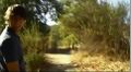 Daniel leads Bree down a trail.